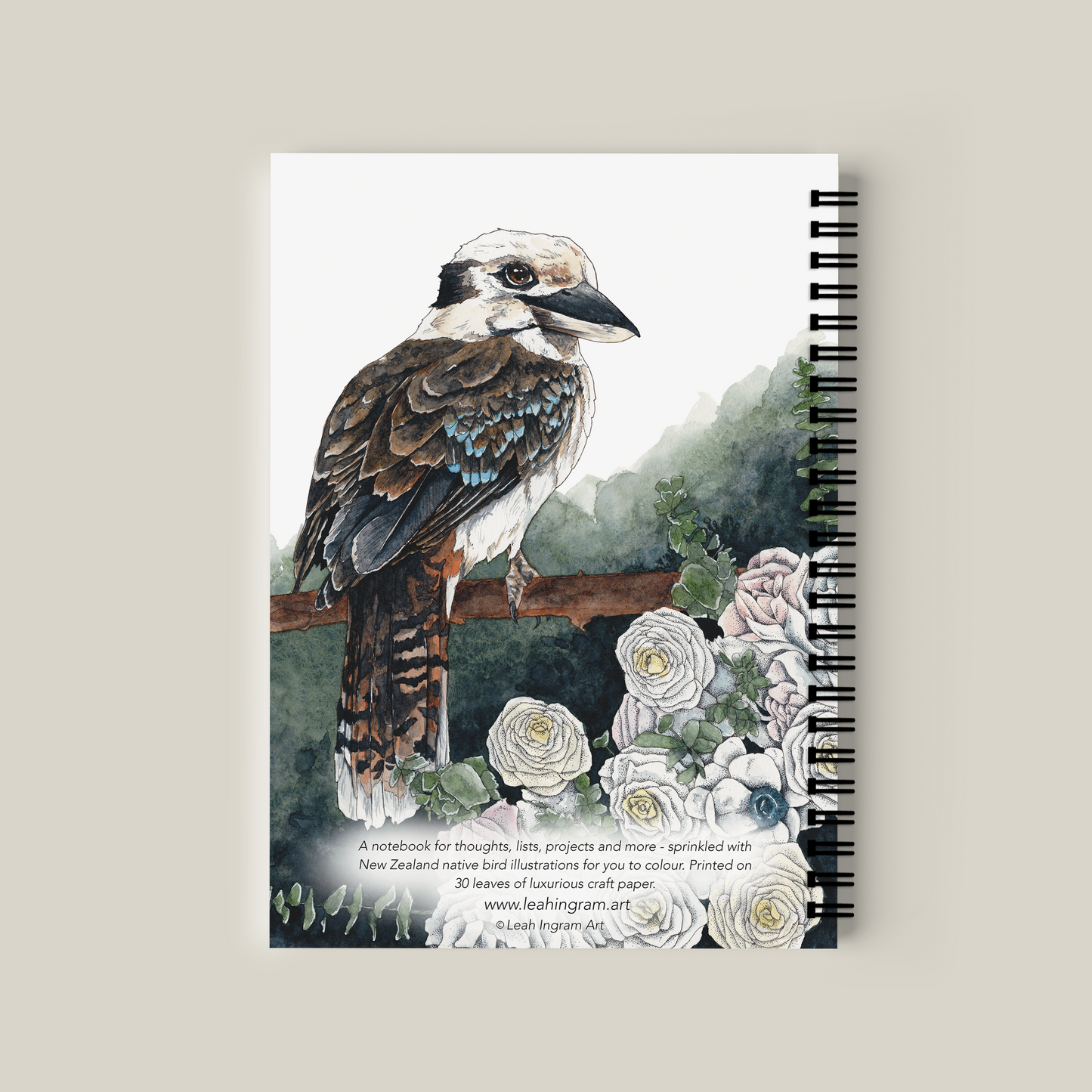 Notebook with a bird illustration on the cover against a beige background