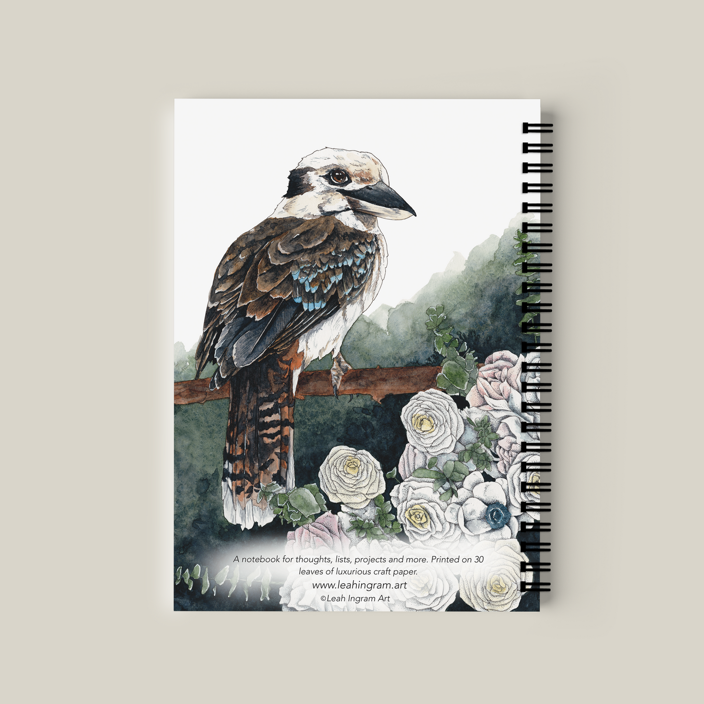 Notebook with a bird illustration on the cover against a beige background
