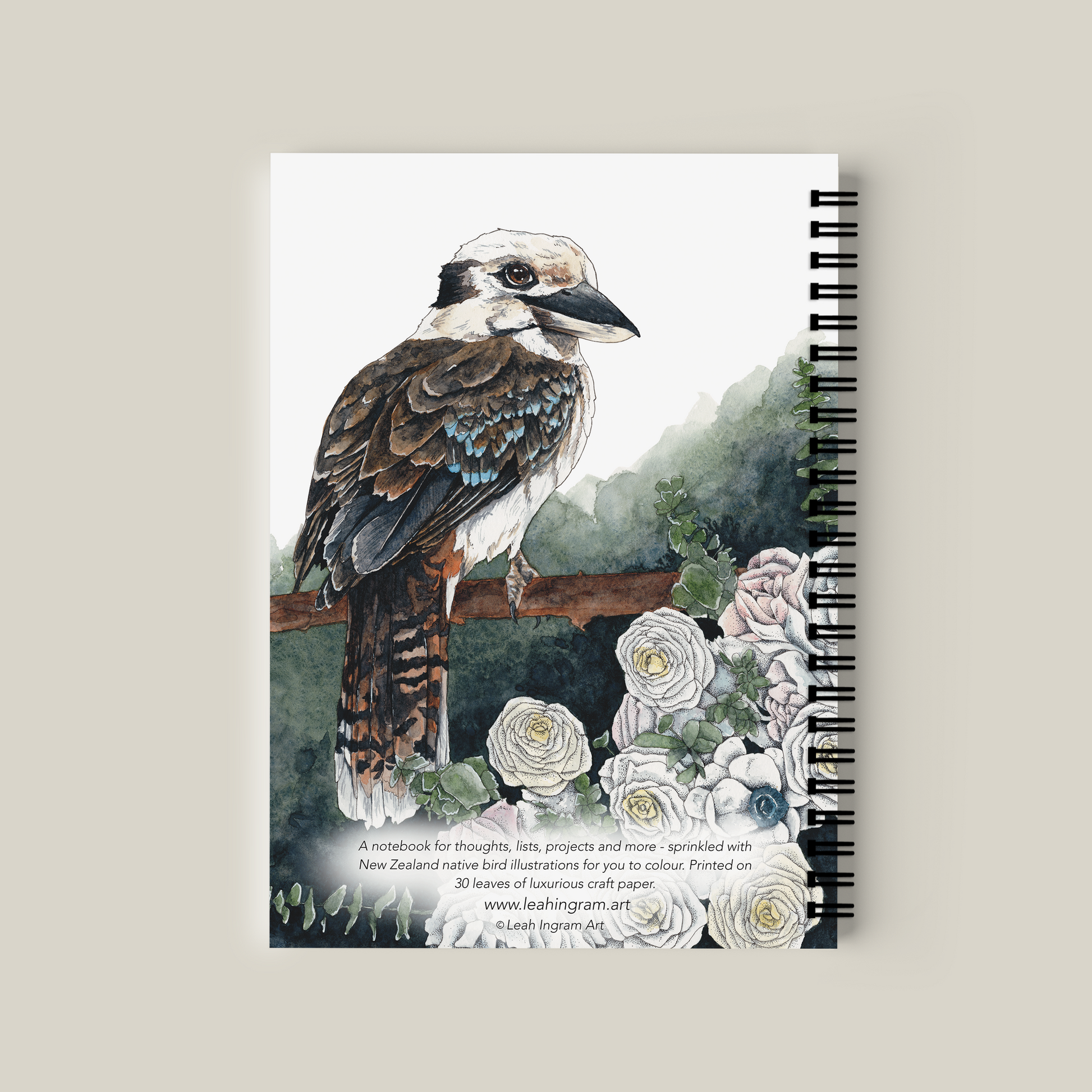 Notebook with a bird illustration on the cover against a beige background