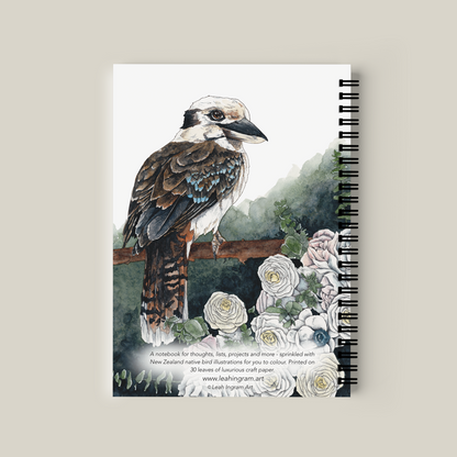 Notebook with a bird illustration on the cover against a beige background
