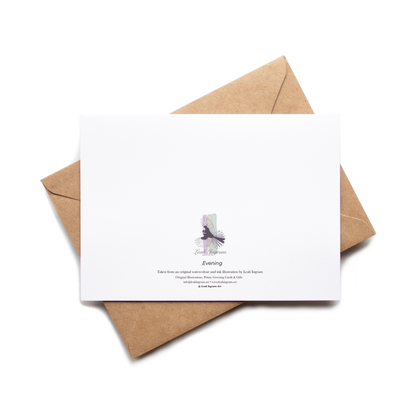 White card with a purple design on a brown envelope against a white background